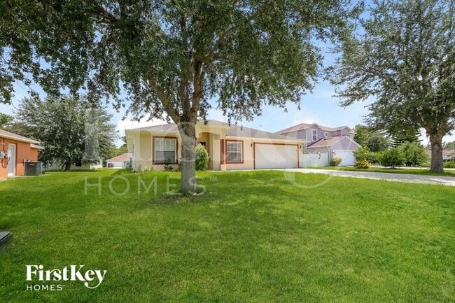 1424 Teal Dr in Poinciana, FL - Building Photo - Building Photo