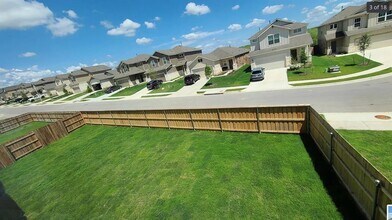 561 Pepperbark Loop in Mustang Ridge, TX - Building Photo - Building Photo