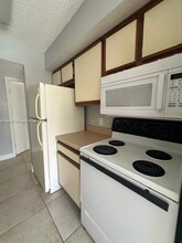 5686 Rock Island Rd, Unit TAMARAC CONDO in Tamarac, FL - Building Photo - Building Photo