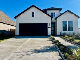 10602 Blossom River Dr in Sienna, TX - Building Photo