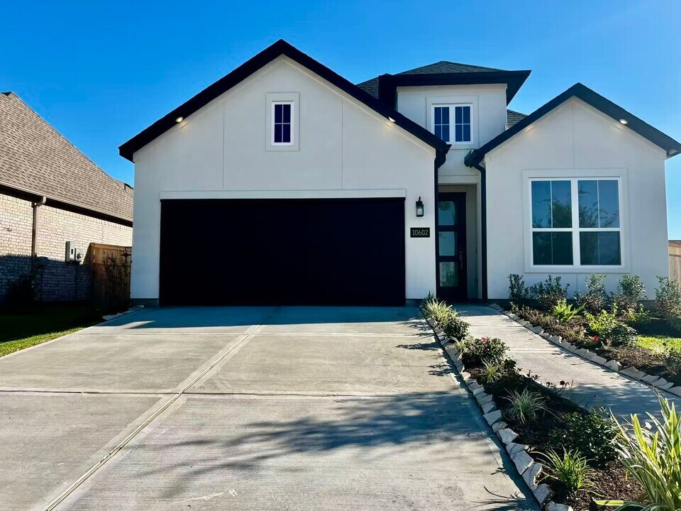 10602 Blossom River Dr in Sienna, TX - Building Photo