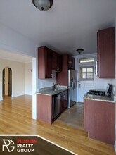 2122 W Ainslie St, Unit 2100-2E in Chicago, IL - Building Photo - Building Photo