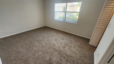 10027 Winding Lake Rd, Unit 101 in Sunrise, FL - Building Photo - Building Photo