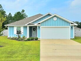 410 Sweet Blossom Bend in Freeport, FL - Building Photo