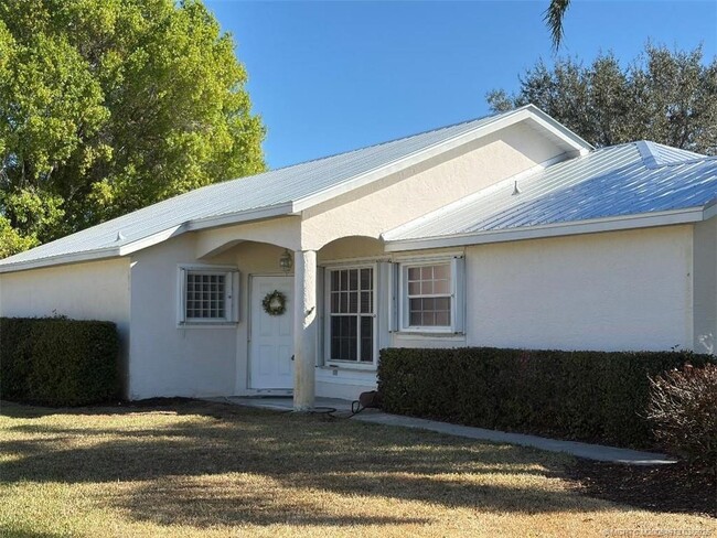 property at 3486 SW Pindo Palm Ln