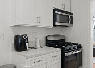 9816 S Hoover St in Los Angeles, CA - Building Photo - Building Photo