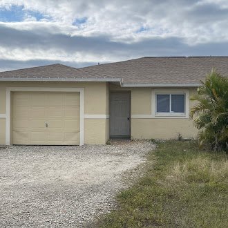 1130 Homer Ave S in Lehigh Acres, FL - Building Photo