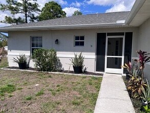 1107 Enrique St E in Lehigh Acres, FL - Building Photo - Building Photo