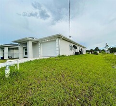 1110 Augusta St E in Lehigh Acres, FL - Building Photo - Building Photo