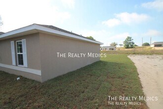 254 Malauka Run in Ocklawaha, FL - Building Photo - Building Photo