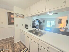 6903 N Lagoon Dr in Panama City, FL - Building Photo - Building Photo