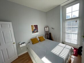 1013 St Paul St, Unit 1B in Baltimore, MD - Foto de edificio - Building Photo