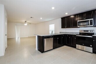 1674 Hideaway Flat St in Mascotte, FL - Building Photo - Building Photo