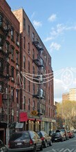 181-185 E Houston St in New York, NY - Building Photo - Building Photo
