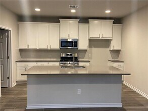 790 Eves Necklace Dr. in Mustang Ridge, TX - Building Photo - Building Photo