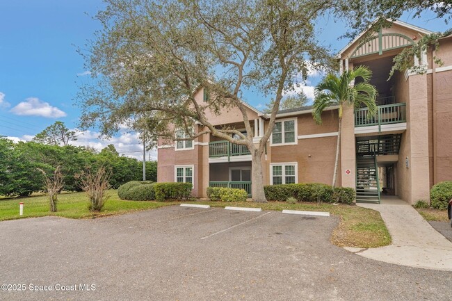 7667 N Wickham Rd, Unit 1201 in Melbourne, FL - Foto de edificio - Building Photo