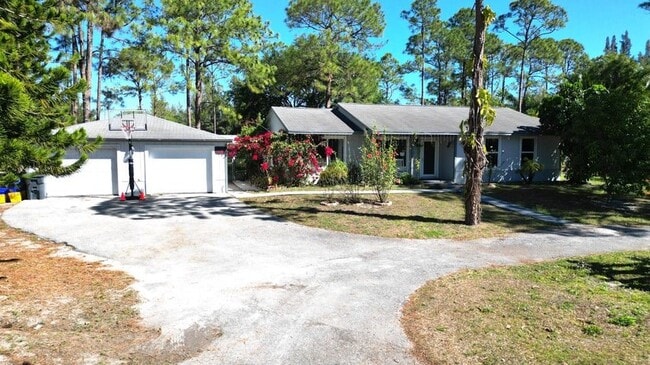 13619 57th Pl N in West Palm Beach, FL - Foto de edificio - Building Photo