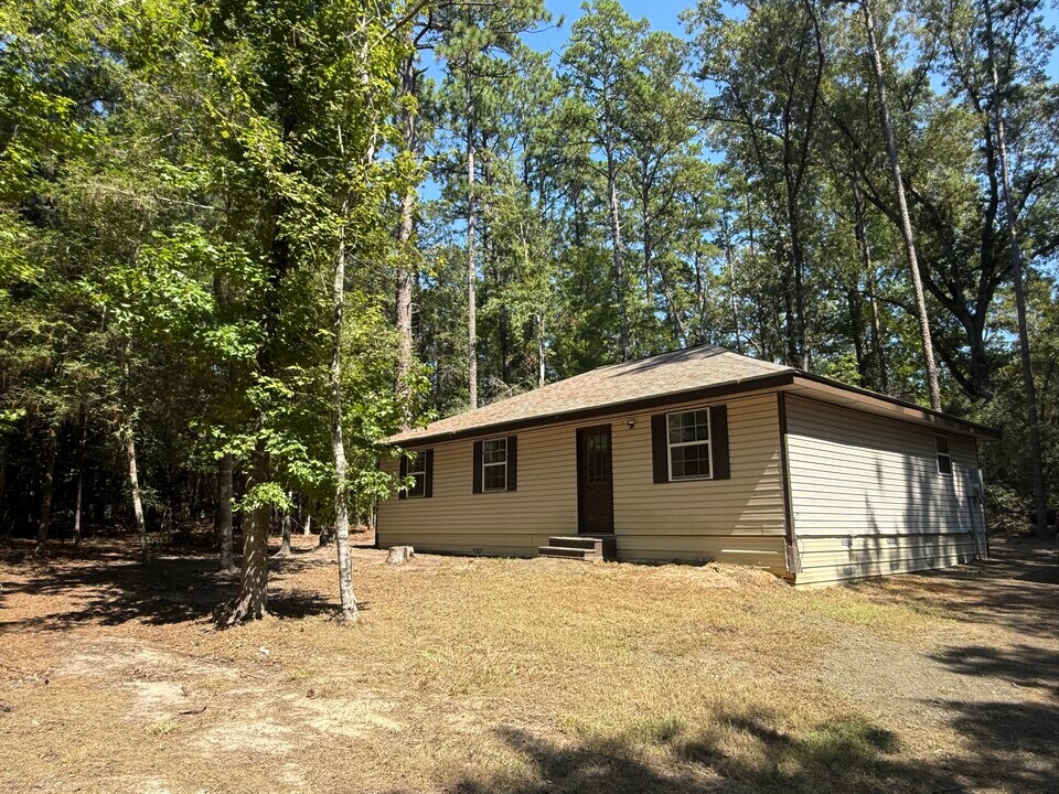57 Drowsy Ln in Brookeland, TX - Building Photo