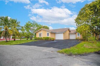 7942 NW 37th Dr in Coral Springs, FL - Building Photo - Building Photo