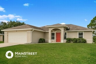 124 Gilbert Ave S in Lehigh Acres, FL - Building Photo - Building Photo