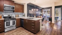 Kitchen and Living Room with Hardwood Floors - Radius Koreatown Apartments in Los Angeles, California
