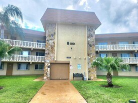 100 Village Green Cir E in Palm Springs, FL - Building Photo