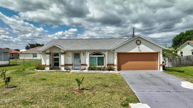 5489 NW Evanston Ave in Port St. Lucie, FL - Building Photo - Building Photo