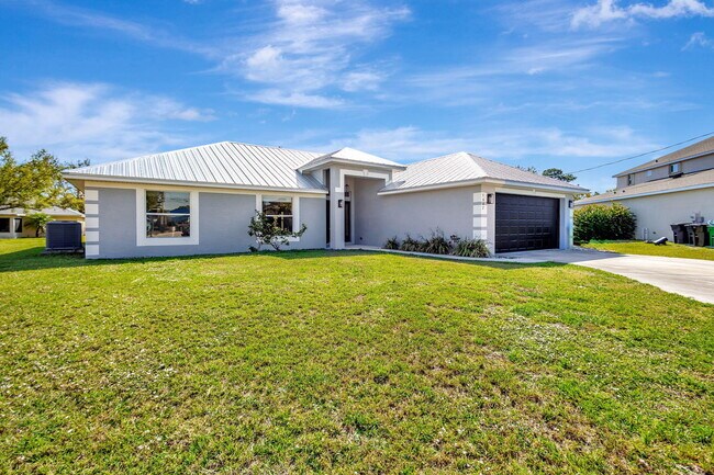 5647 NW Lorna Ct in Port St. Lucie, FL - Building Photo - Building Photo