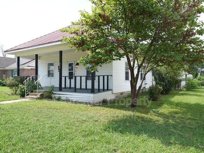 property at 323 E Will Rogers Blvd