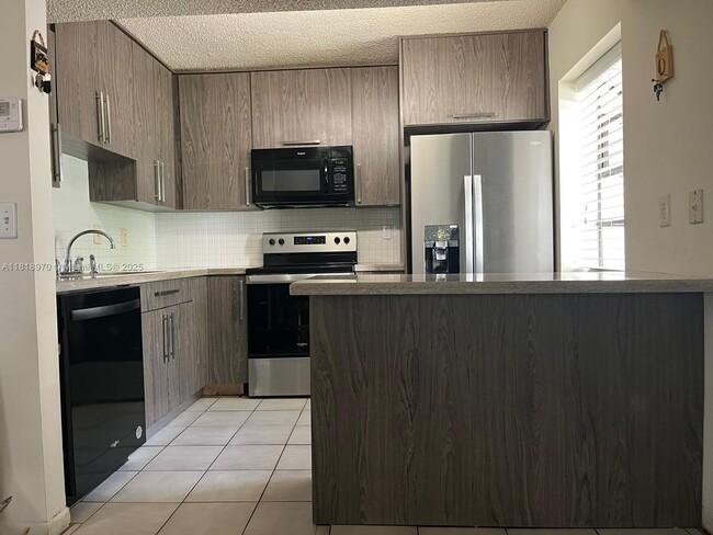 property at 9813 NW 3 St