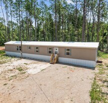 15506 N Paradise Park Ln in Independence, LA - Building Photo