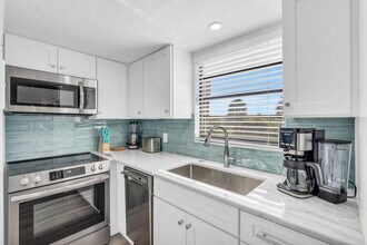 580 Neapolitan Way-Unit -FL2-ID1073556P in Naples, FL - Building Photo - Building Photo