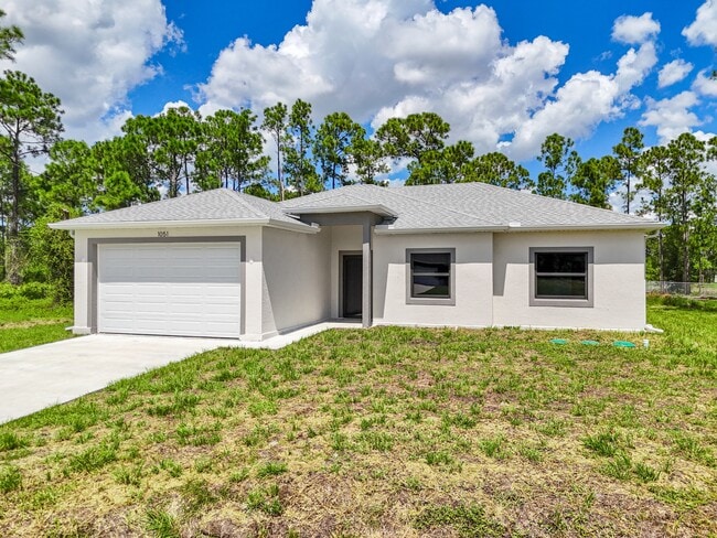 1051 Milwaukee Blvd in Lehigh Acres, FL - Building Photo - Building Photo