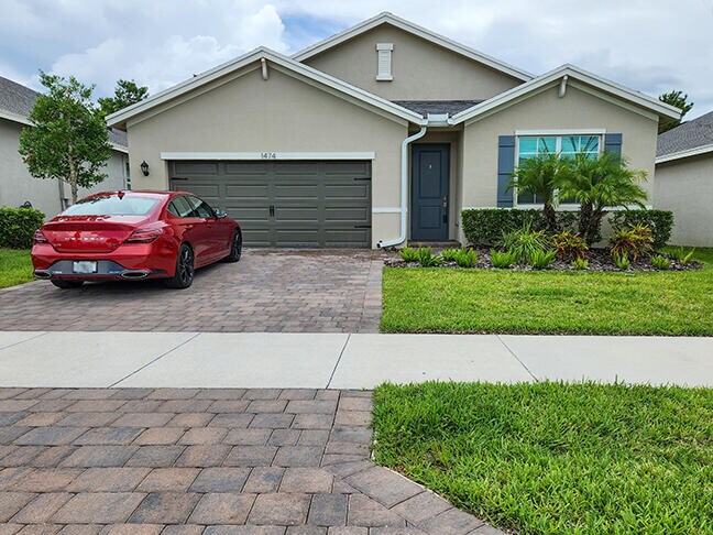 1474 NE White Pine Terrace in Ocean Breeze, FL - Building Photo