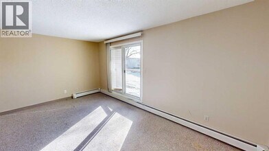 10028-10105 105 Ave in Grande Prairie, AB - Building Photo - Building Photo