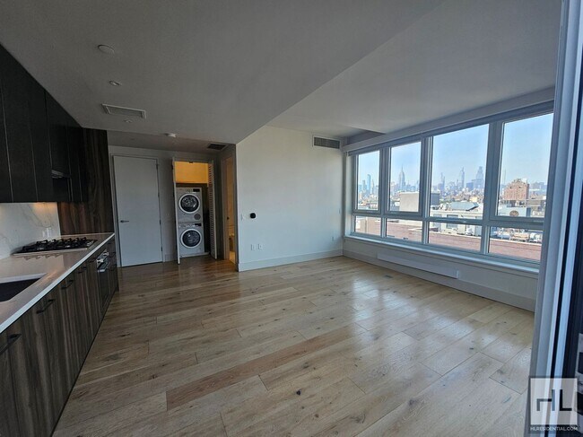 Modern 1-Bedroom with Private Balcony | Ea in New York, NY - Building Photo - Building Photo