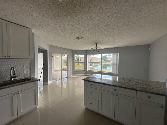 7700 Stone Harbour Dr in Greenacres, FL - Building Photo - Building Photo