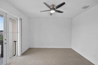 7651 N Pine Island Rd in Tamarac, FL - Building Photo - Building Photo