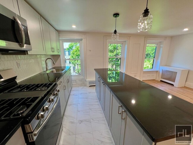 2BR 1BA Classic Details Top Floor Brownstone w/ New Modern Finish on Preserved Bedstuy Block, Unit 3 in Brooklyn, NY - Building Photo - Building Photo
