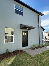 8795 Coqui Song Ln in Land O Lakes, FL - Foto de edificio - Building Photo