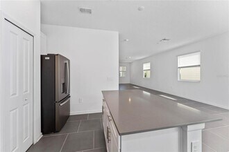 7728 Stone Crk Trl in Kissimmee, FL - Building Photo - Building Photo