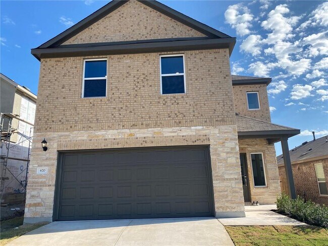670 Pepperbark Loop in Mustang Ridge, TX - Building Photo - Building Photo