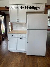 33 Washington St, Unit 1 in Sparta, MI - Foto de edificio - Building Photo