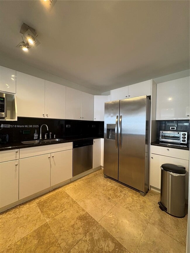 property at 6039 Collins Ave