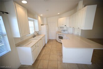 7558 Rozzini Ln in Naples, FL - Building Photo - Building Photo