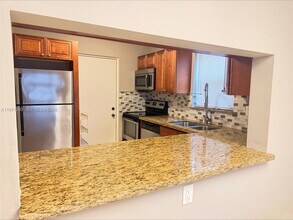 2316 S Cypress Bend Dr, Unit 102 in Pompano Beach, FL - Building Photo - Building Photo