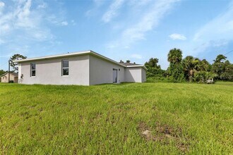 924 Tropical Ave NW in Port Charlotte, FL - Building Photo - Building Photo