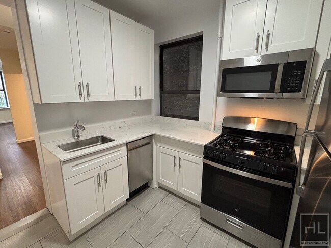 229-231-231 E 12th St