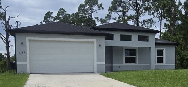 1218 Ecstasy St E in Lehigh Acres, FL - Building Photo - Building Photo