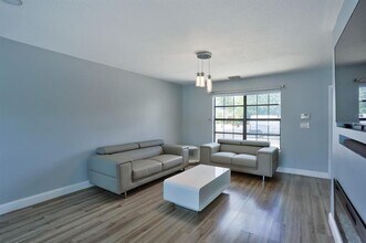 6052 Lace Wood Cir in Atlantis, FL - Building Photo - Building Photo
